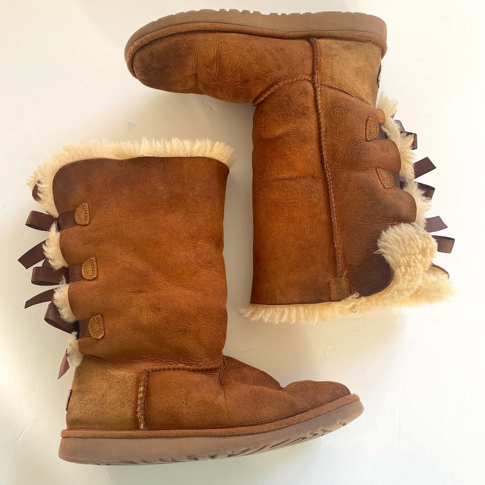 UGG Bailey Bow tall, women's size 5, in chestnut with sheepskin lining.